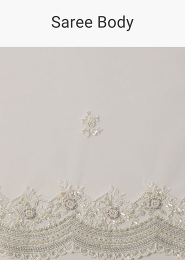 White Net Saree With All Over Embroidery