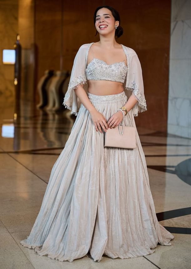 White Ruched Lehenga With Spaghetti Blouse And Cape