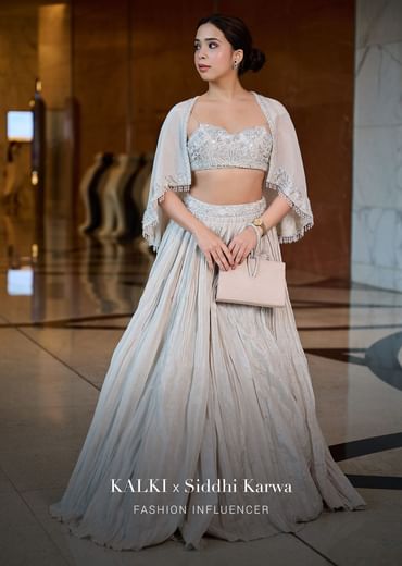 White Ruched Lehenga With Spaghetti Blouse And Cape