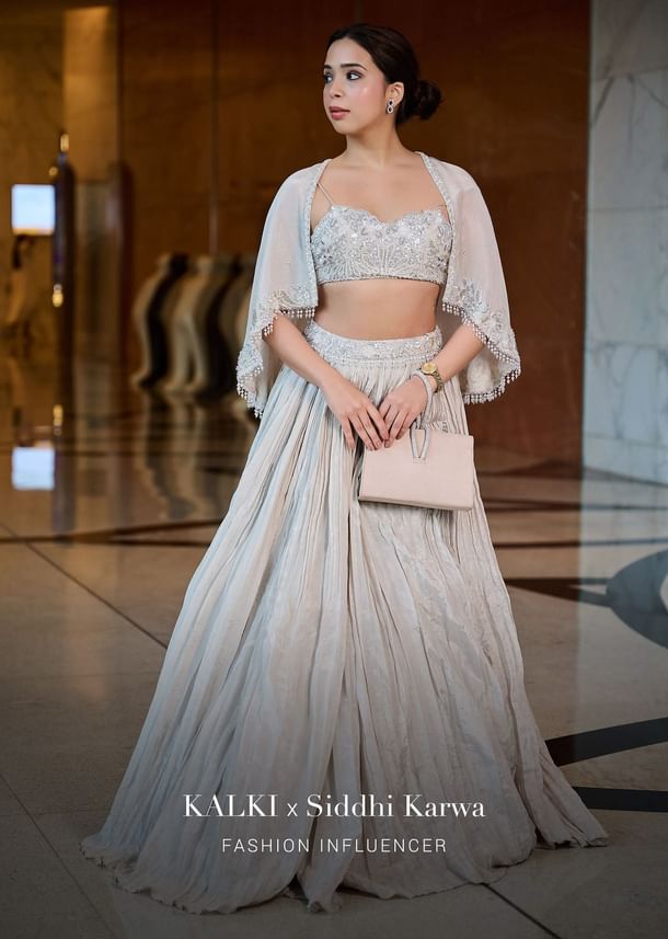 White Ruched Lehenga With Spaghetti Blouse And Cape