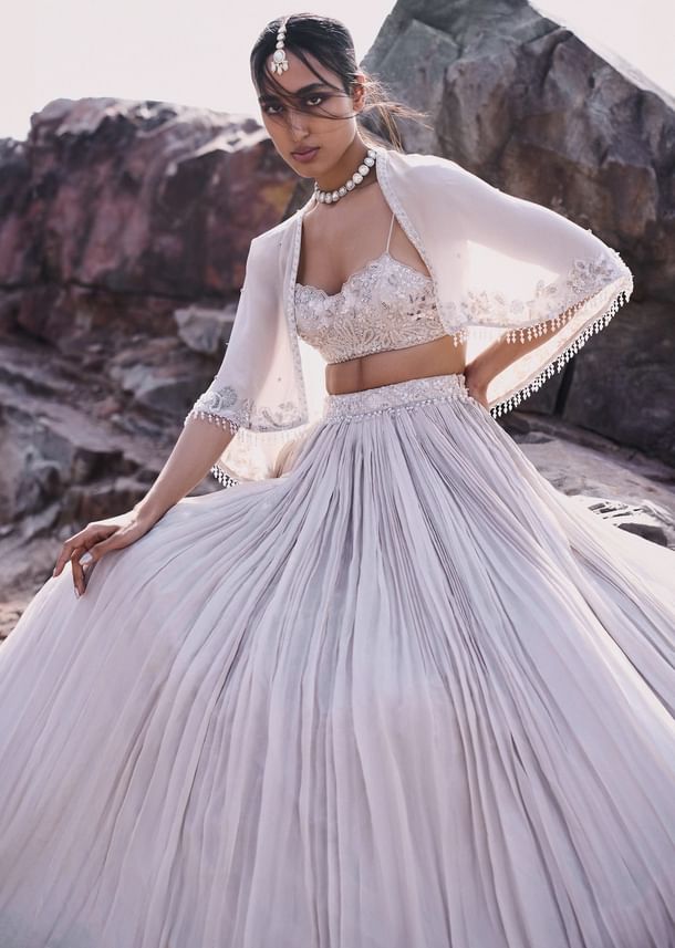 White Ruched Lehenga With Spaghetti Blouse And Cape