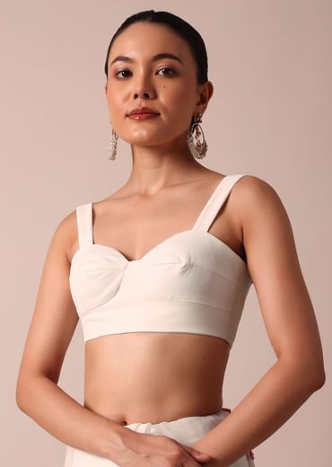 White saree with floral embroidery and unstitched blouse