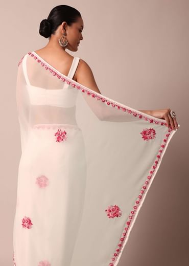 White saree with floral embroidery and unstitched blouse