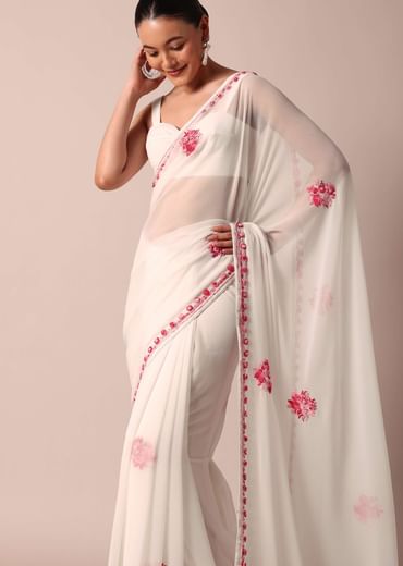 White saree with floral embroidery and unstitched blouse