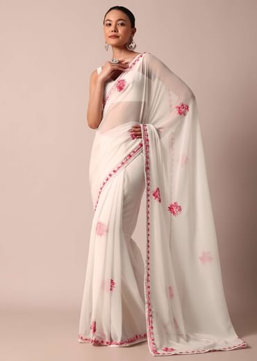White saree with floral embroidery and unstitched blouse