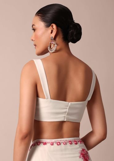 White saree with floral embroidery and unstitched blouse