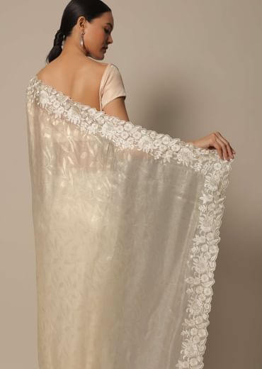 White Satin Saree With Floral Motif Thread Work And Unstitched Blouse Piece